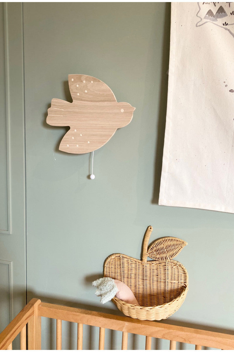 Boite à musique murale en bois et en forme d'hirondelle.